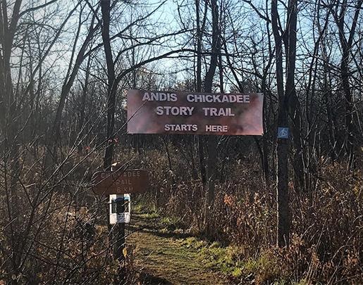 Large version of sign for Andis Chickadee Story Trail hanging above trail head